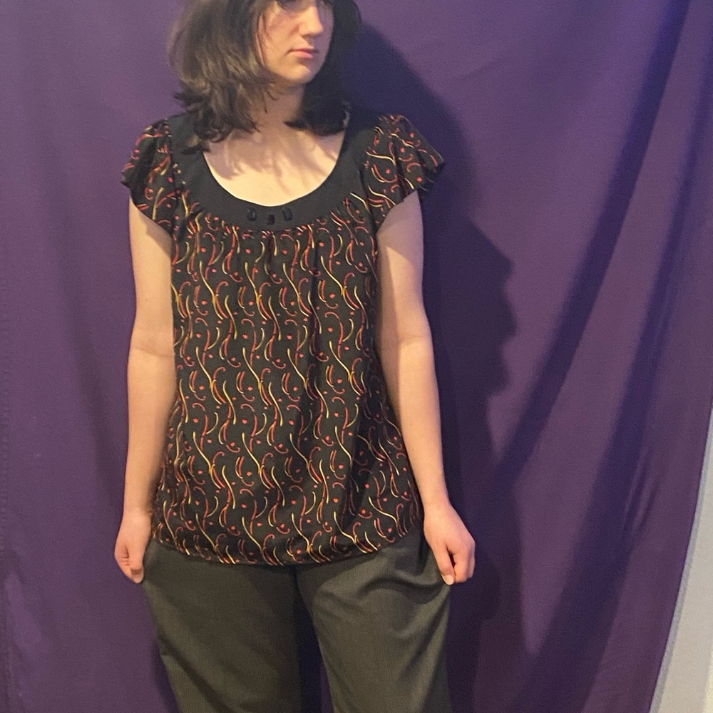 Black Top with Colorful Swirl Pattern
